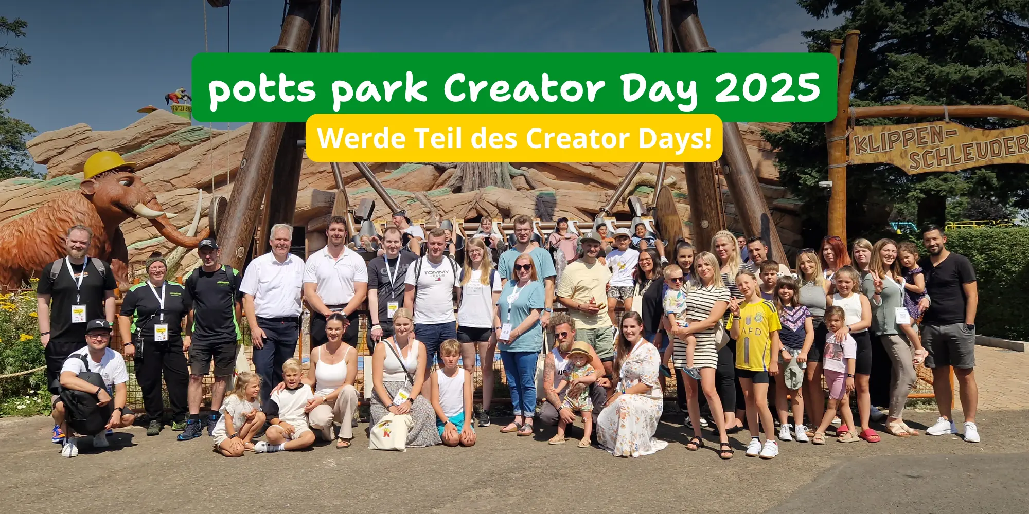 creator-day-2025 Creator Day 2025: Gruppe von Menschen steht vor einem Fahrgeschäft bei sonnigem Wetter